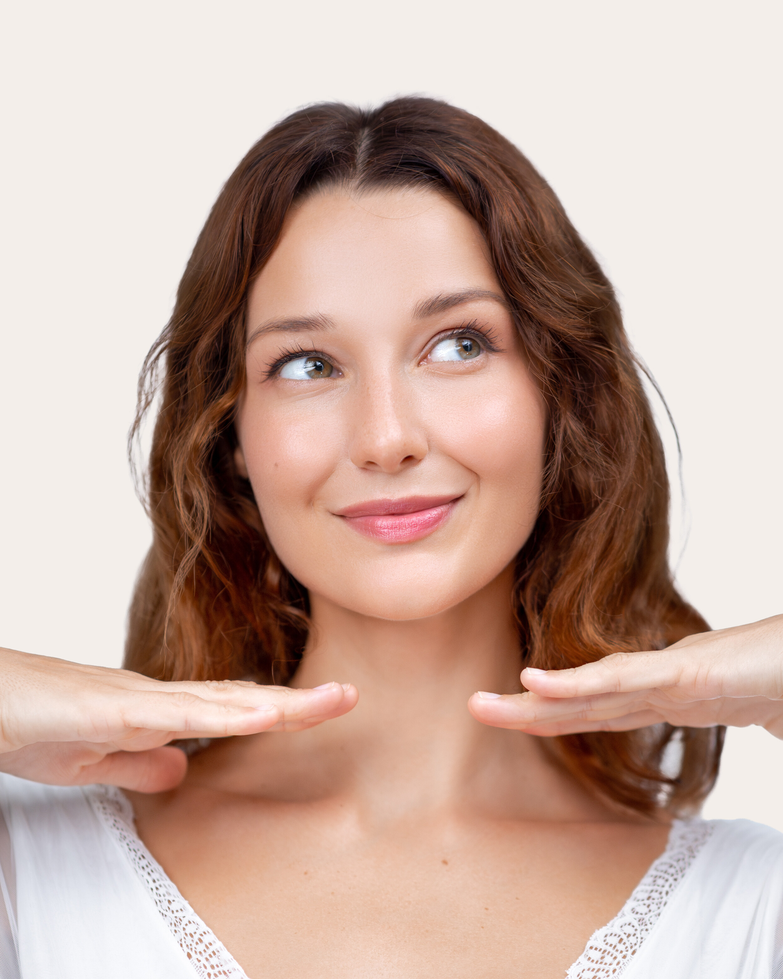 Portrait of a woman in a bright room with balanced, natural facial proportions